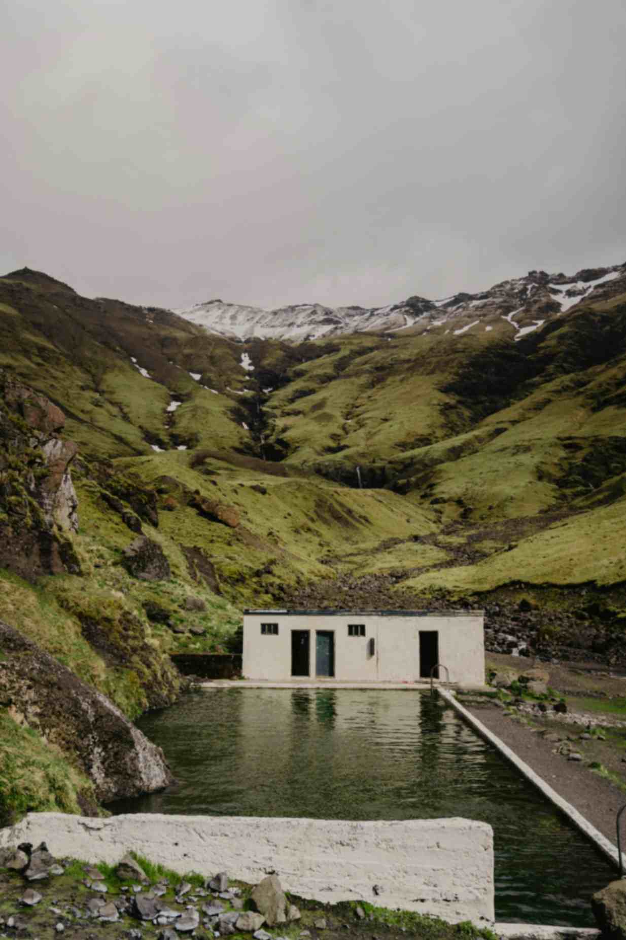 Seljavallalaug historic mountain pool surrounded by mossy cliffs in South Iceland Seljavallalaug historic mountain pool surrounded by mossy cliffs in South Iceland