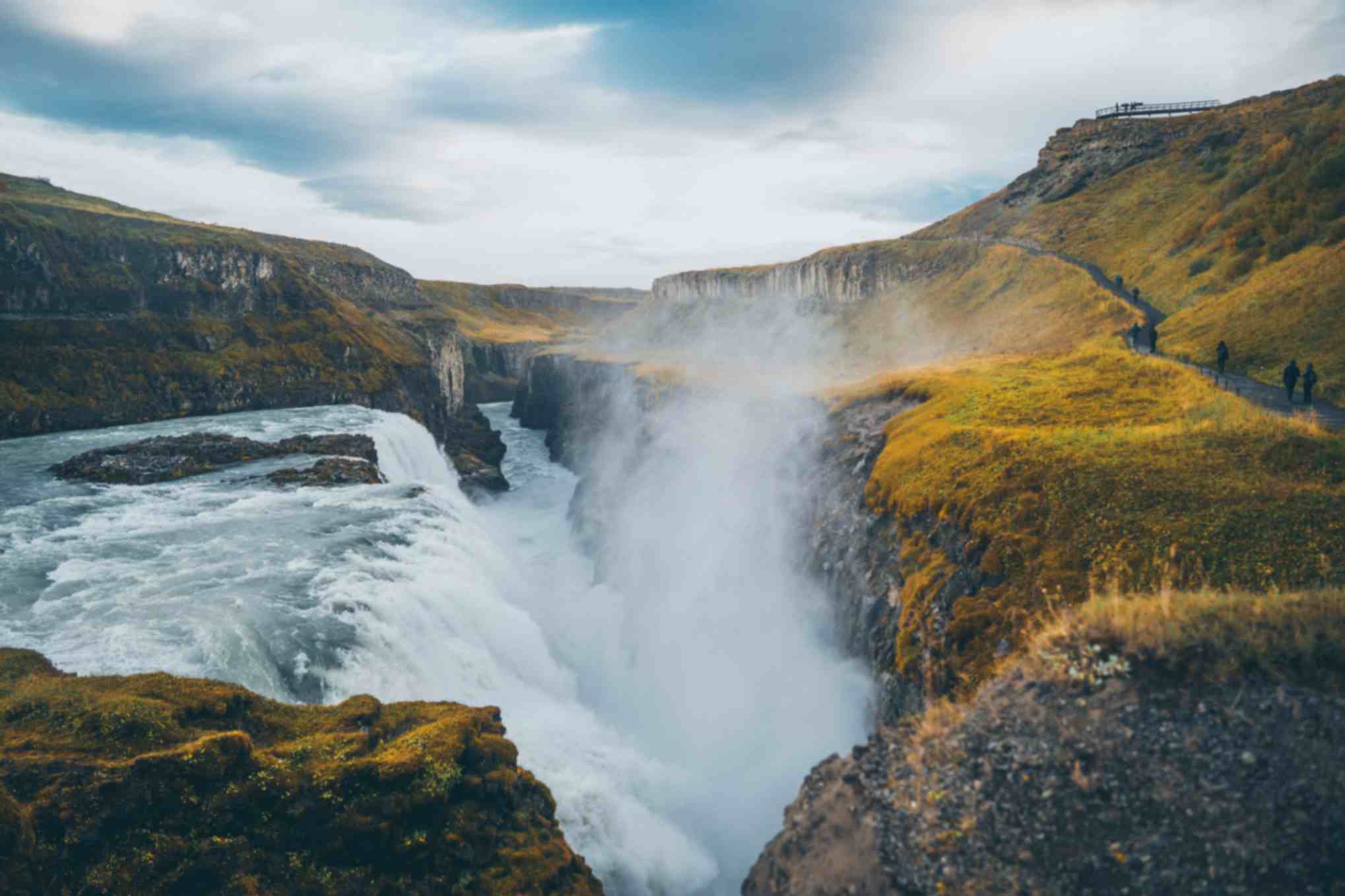 Gullfoss waterfall on the Golden Circle route in Iceland with mist rising from the canyon Gullfoss waterfall on the Golden Circle route in Iceland with mist rising from the canyon