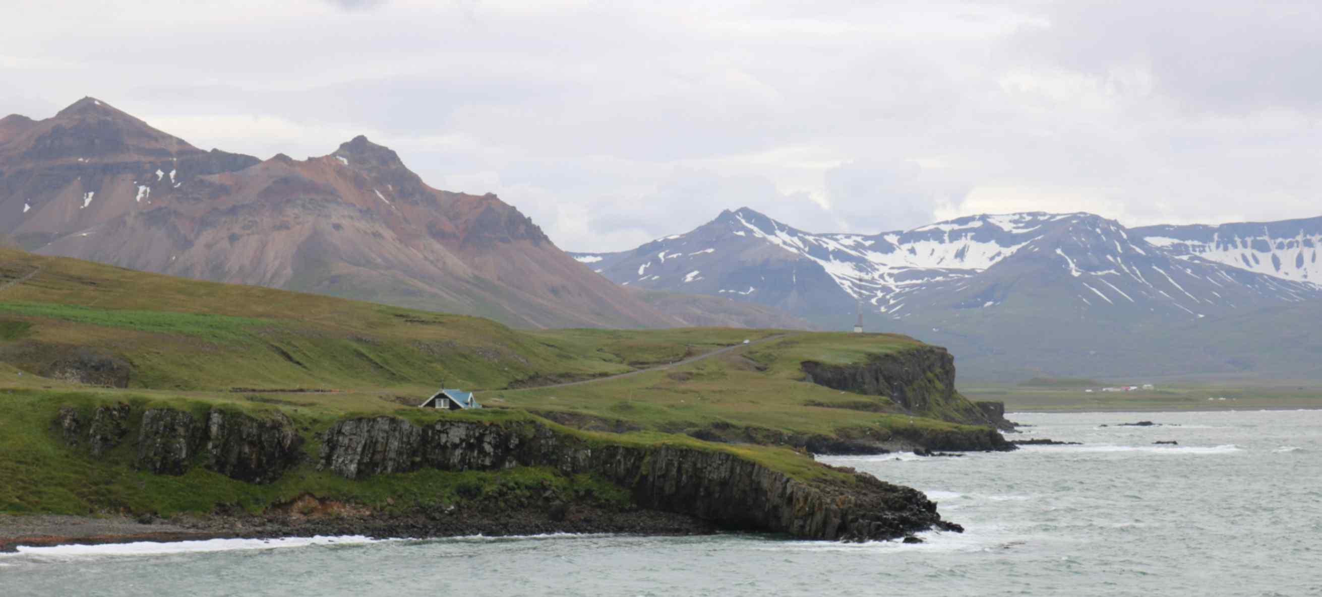 Coastal cliffs and mountains near Borgarfjörður Eystri in East Iceland, one of the best puffin viewing areas Coastal cliffs and mountains near Borgarfjörður Eystri in East Iceland, one of the best puffin viewing areas
