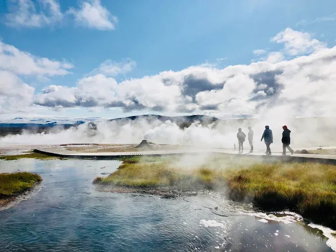 Hveravellir geothermal hot spring pool surrounded by steaming highland landscape in Iceland Hveravellir geothermal hot spring pool surrounded by steaming highland landscape in Iceland
