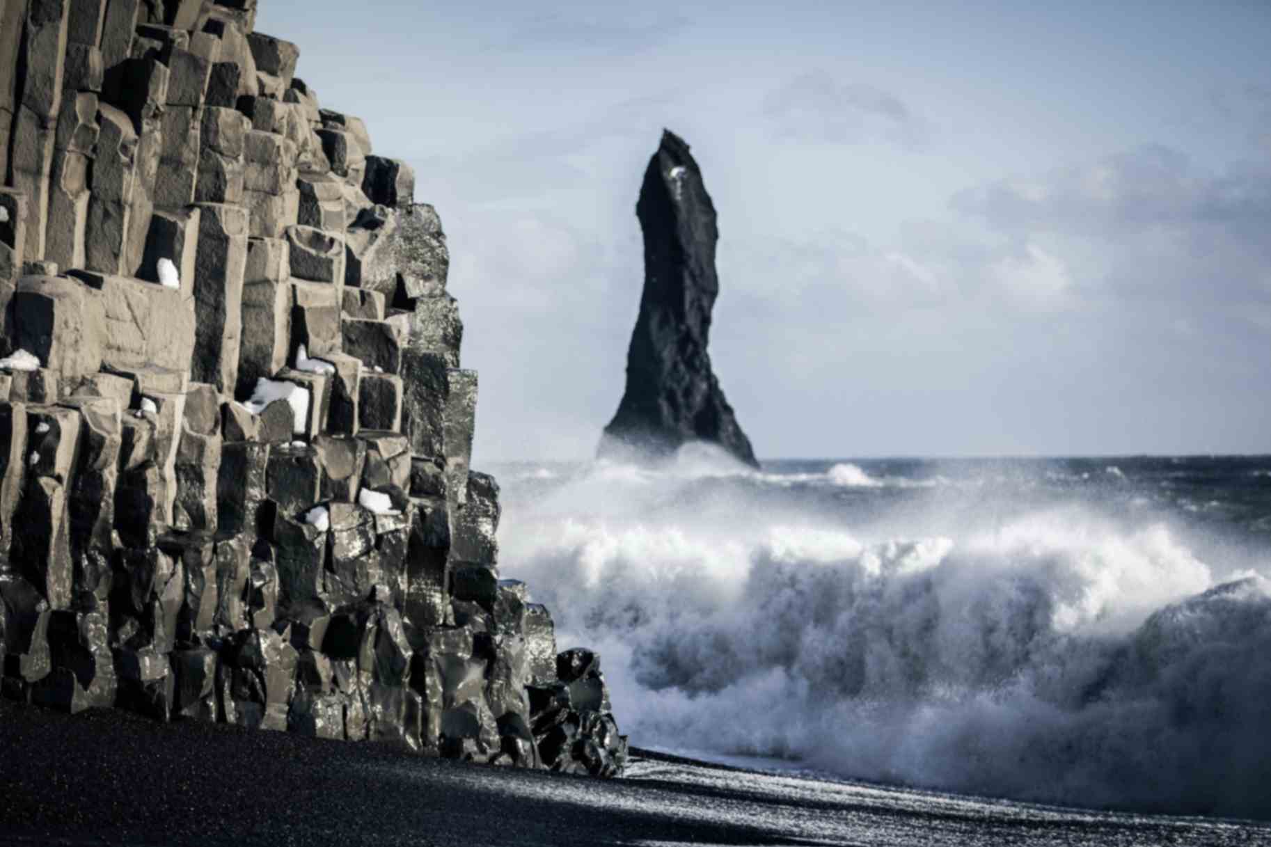 Basalt columns and sea stacks at Reynisfjara black sand beach on Iceland’s South Coast Basalt columns and sea stacks at Reynisfjara black sand beach on Iceland’s South Coast