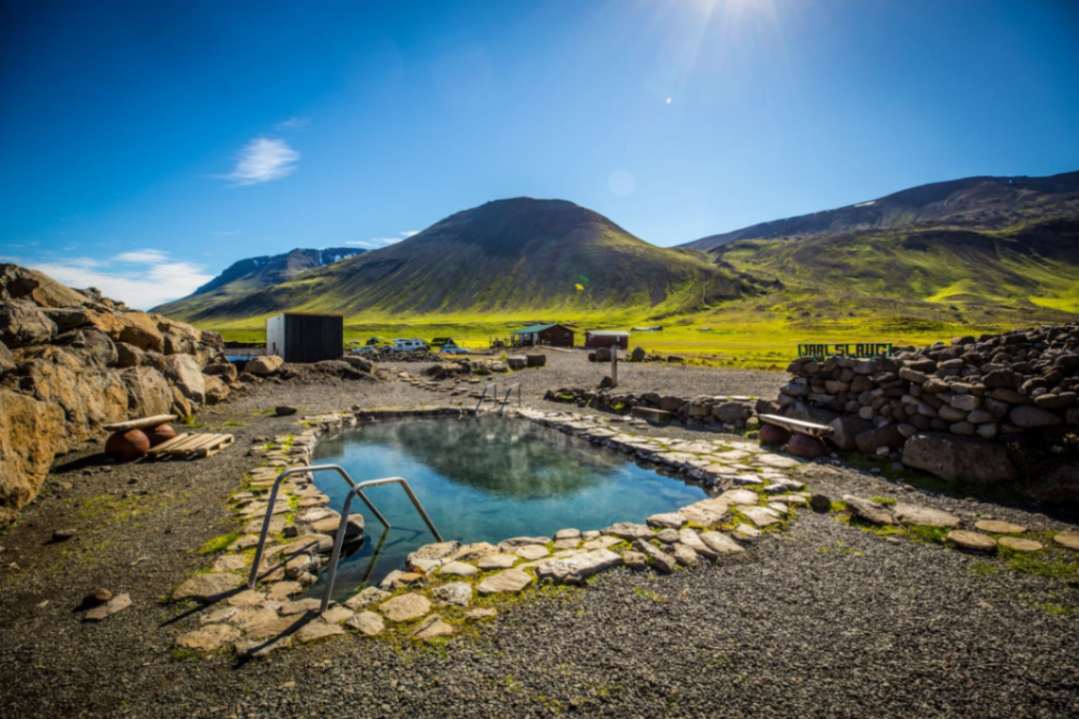 Grettislaug seaside hot spring pool overlooking Skagafjörður fjord in North Iceland Grettislaug seaside hot spring pool overlooking Skagafjörður fjord in North Iceland