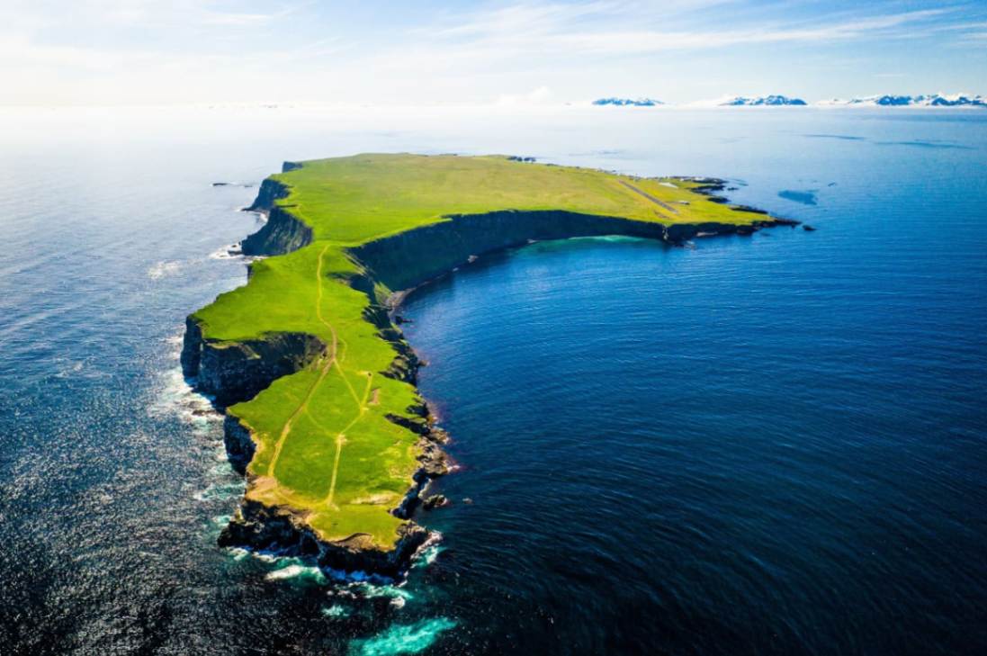Aerial view of Grímsey Island cliffs in North Iceland located on the Arctic Circle Aerial view of Grímsey Island cliffs in North Iceland located on the Arctic Circle