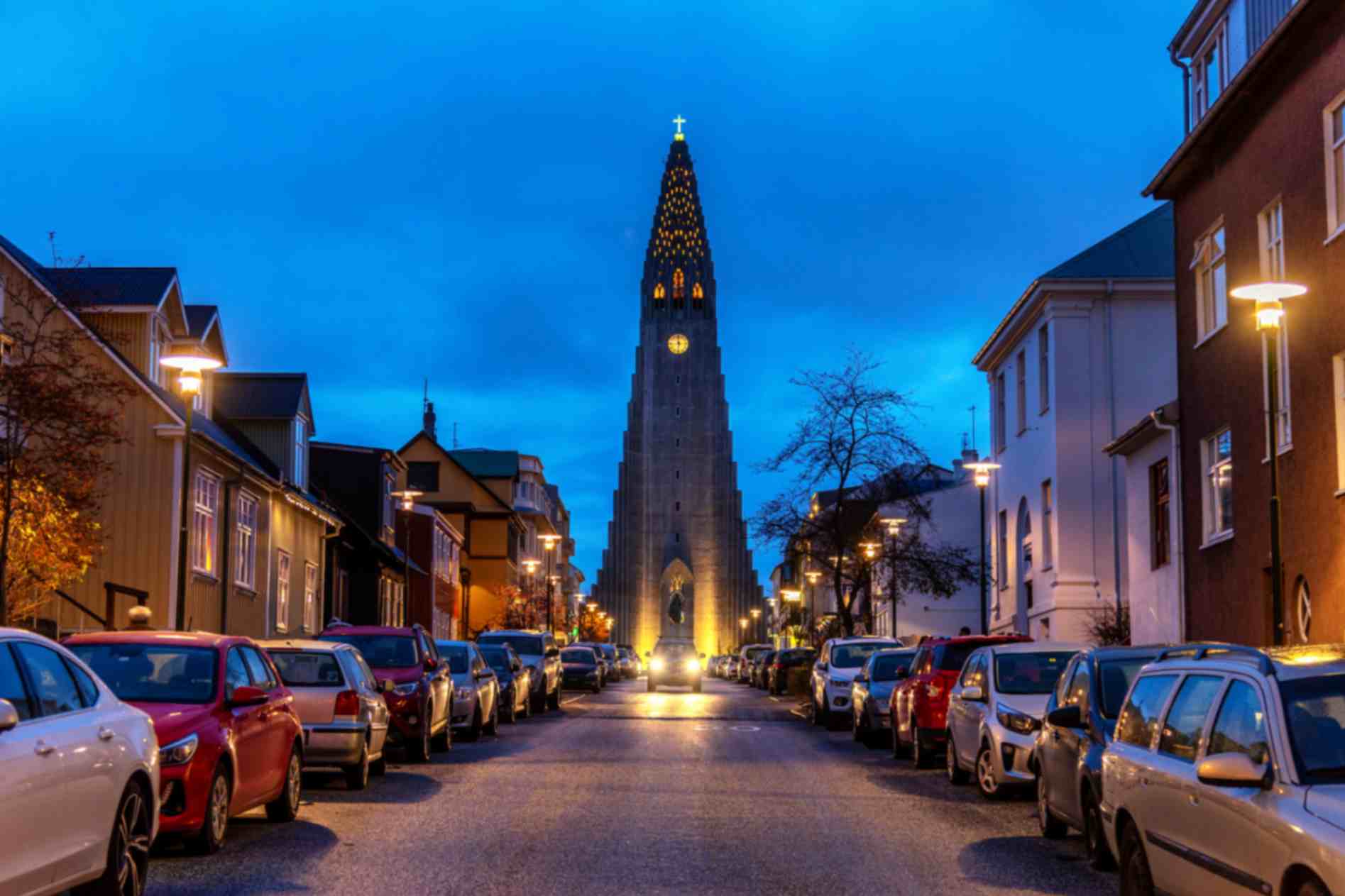 Hallgrimskirkja church illuminated at night in Reykjavik Iceland with street view
